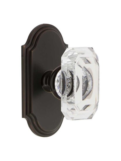 Grandeur Arc Rosette Door Set with Clear Crystal-Glass Baguette Knobs in Timeless Bronze.
